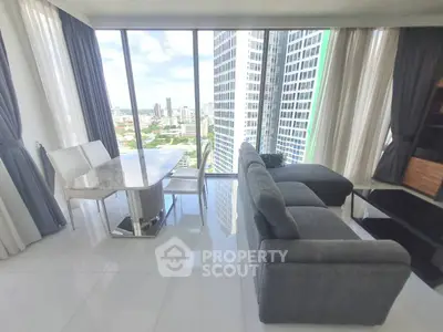 Luxurious high-rise living room with panoramic city views and modern furnishings.