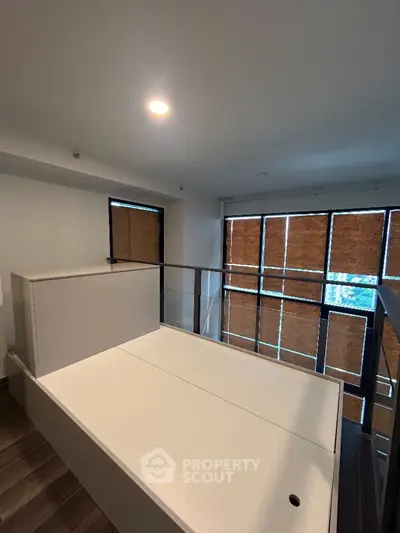 Modern interior with large windows and sleek design, perfect for urban living.