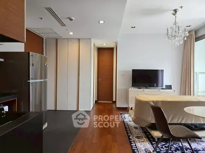 Modern living room with elegant chandelier and sleek furniture design