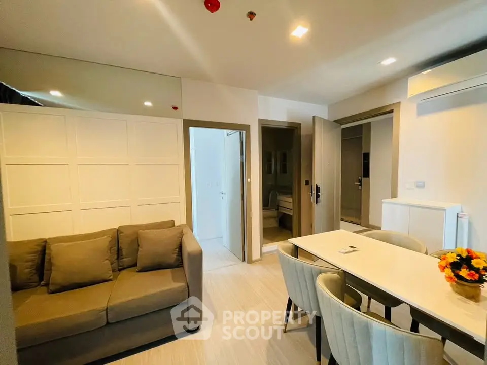 Modern living room with cozy sofa and dining area in a stylish apartment