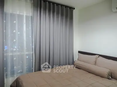 Cozy bedroom with elegant curtains and soft bedding, perfect for restful nights.