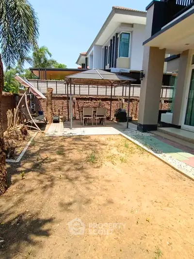 Spacious backyard with patio and modern house exterior