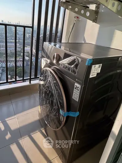 Modern washing machine on a high-rise balcony with cityscape view, perfect for urban living.