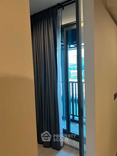Modern apartment with floor-to-ceiling windows and balcony view