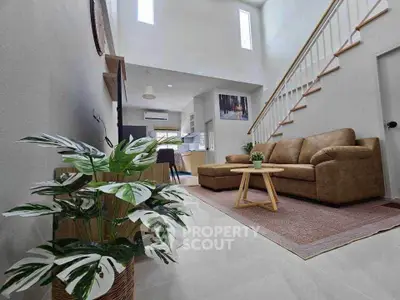 Spacious modern living room with high ceiling and stylish decor