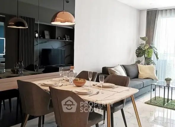 Modern open-plan living and dining area with stylish decor and natural light.