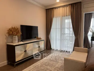 Elegant living room with modern decor and large window drapes