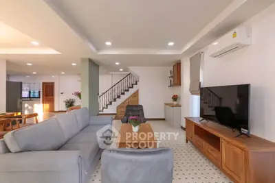 Spacious modern living room with stylish furniture and open layout