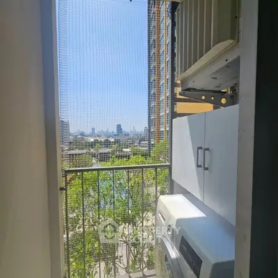 Charming balcony with laundry area and city view, perfect for urban living.
