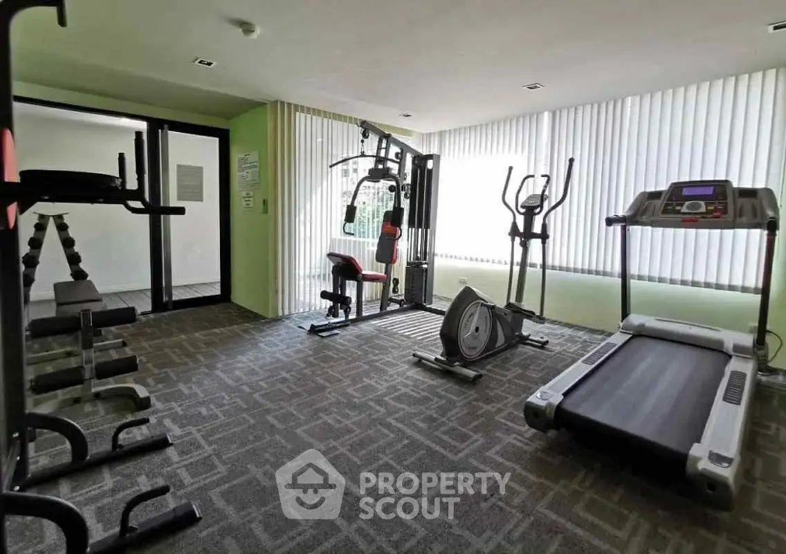 Modern gym with state-of-the-art fitness equipment in a residential building.