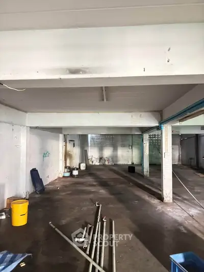 Spacious industrial warehouse with high ceilings and ample storage potential.