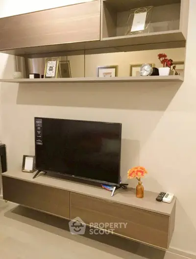 Modern living room with sleek TV unit and stylish shelving