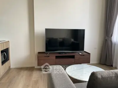 Modern living room with sleek TV setup and stylish furniture