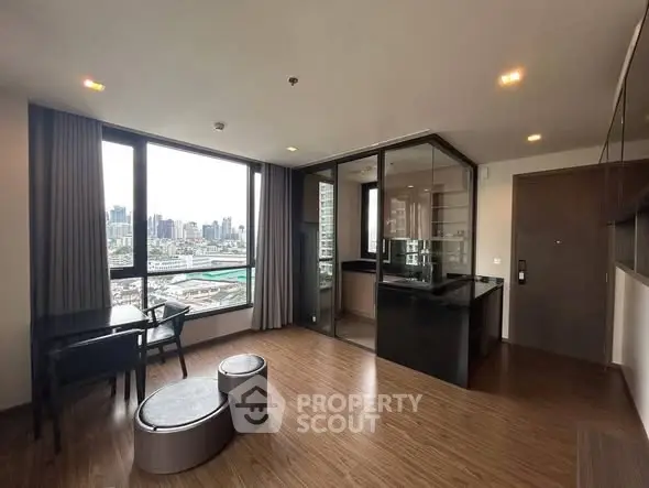 Modern apartment with city view, featuring open layout and stylish furnishings.