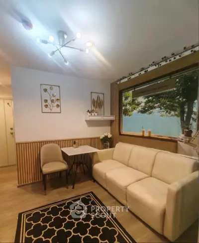 Modern living room with stylish decor and comfortable seating, perfect for relaxation and entertainment.