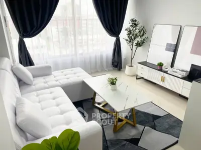 Modern living room with white sofa, marble coffee table, and large windows.