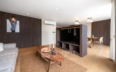 Modern living room with stylish wooden decor and open dining area