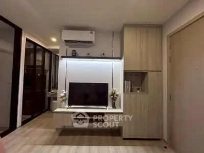 Modern living room with sleek TV setup and stylish wooden cabinetry