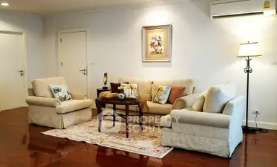 Elegant living room with plush sofas and warm lighting, perfect for relaxation and entertaining.