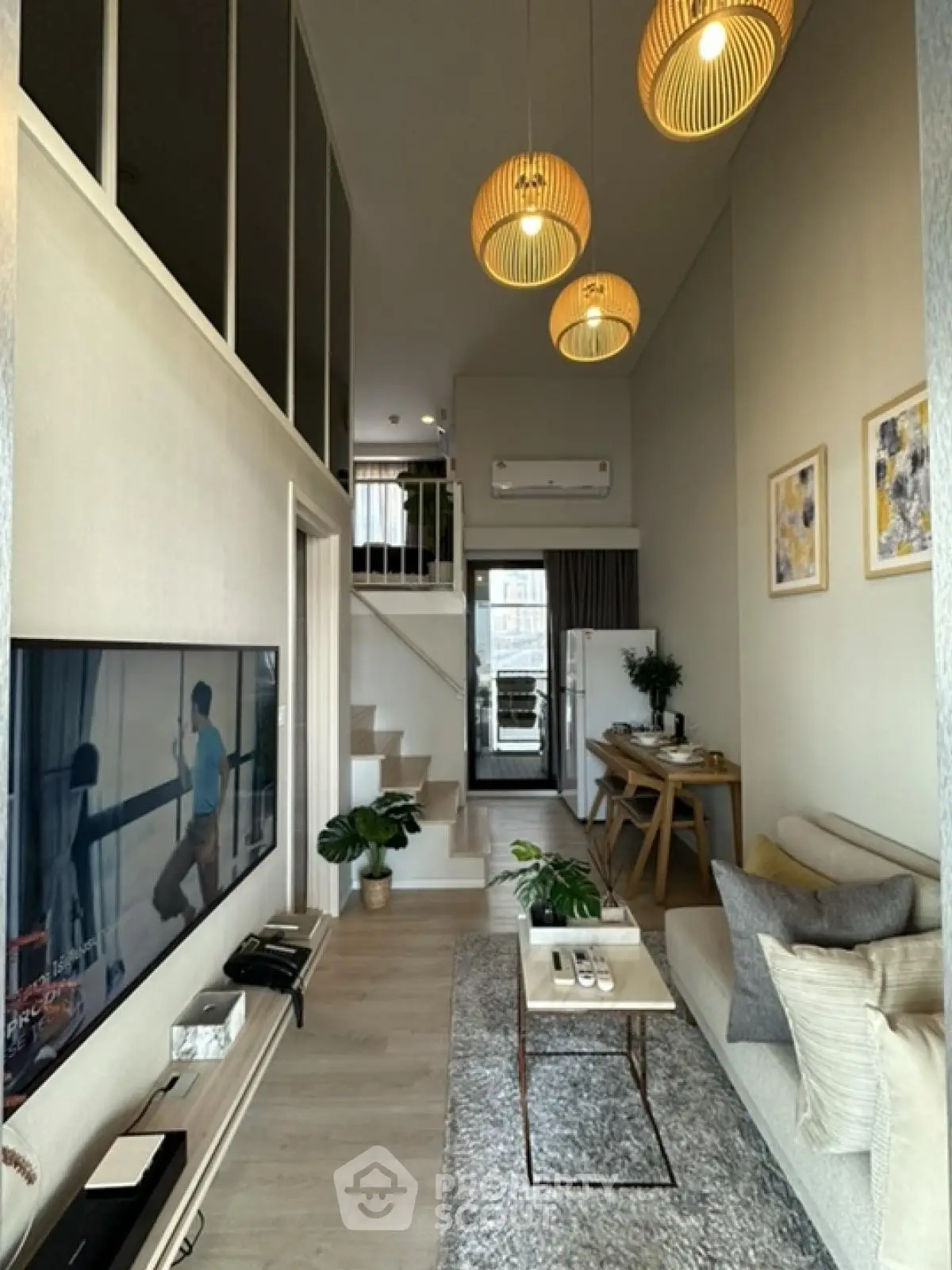 Modern duplex living room with stylish decor and high ceiling
