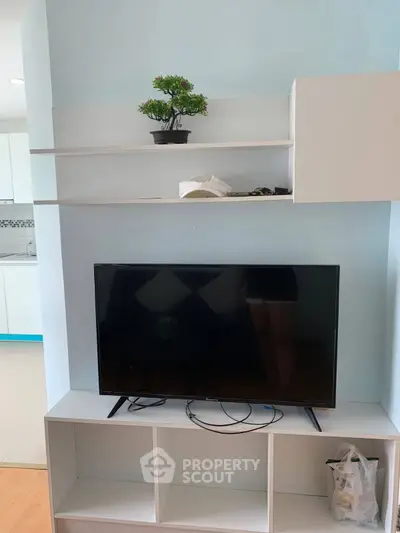 Modern living room with sleek TV stand and minimalist decor