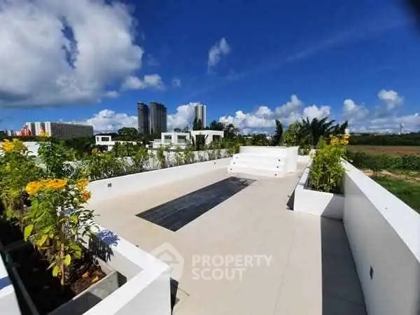 Stunning rooftop garden with panoramic city views and lush greenery, perfect for relaxation and entertainment.