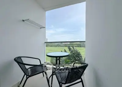 Charming balcony with scenic view and stylish outdoor seating