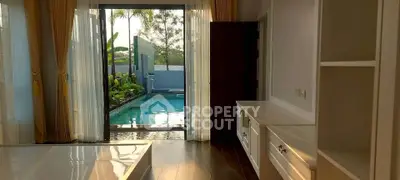 Luxurious bedroom with pool view and elegant interior design