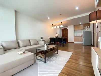 Spacious modern living room with open kitchen and elegant decor