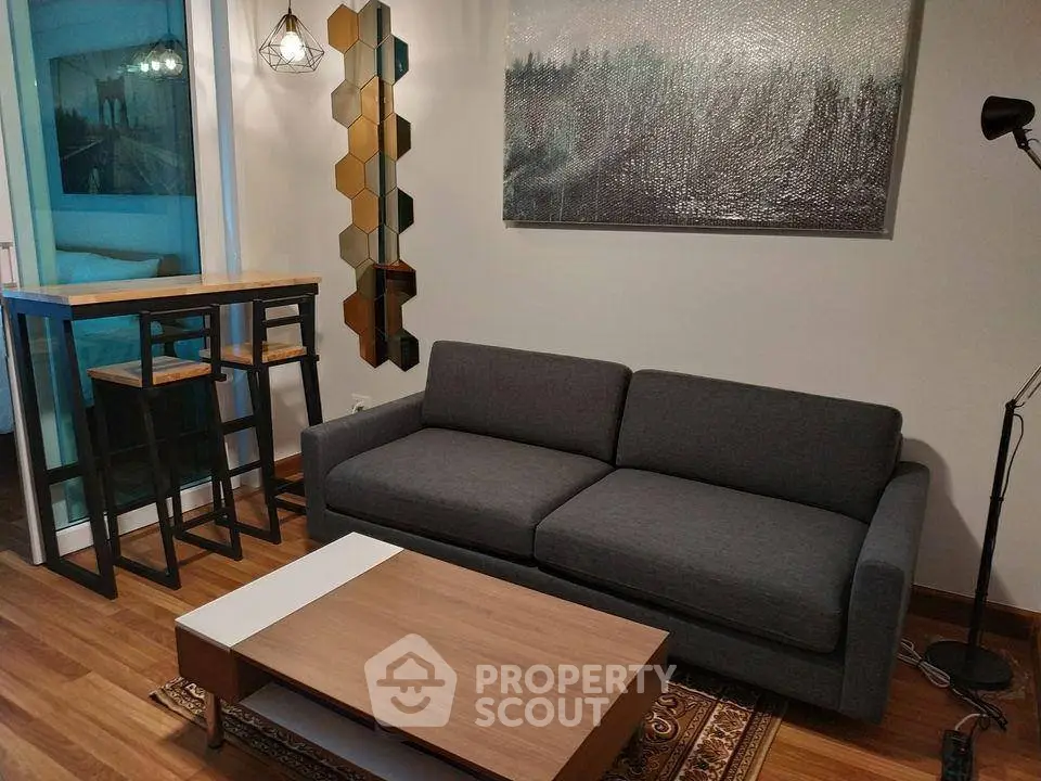 Modern living room with stylish furniture and unique wall art, perfect for urban living.