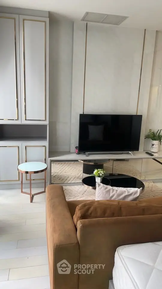 Modern living room with sleek TV setup and stylish furniture