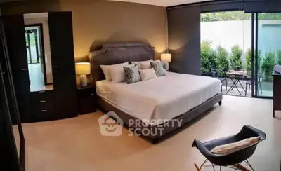 Luxurious bedroom with modern decor and garden view
