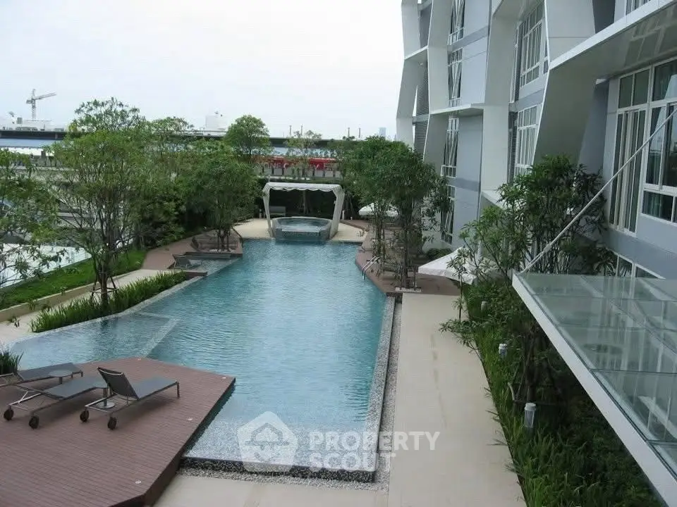 Luxurious modern apartment with stunning pool and lush greenery