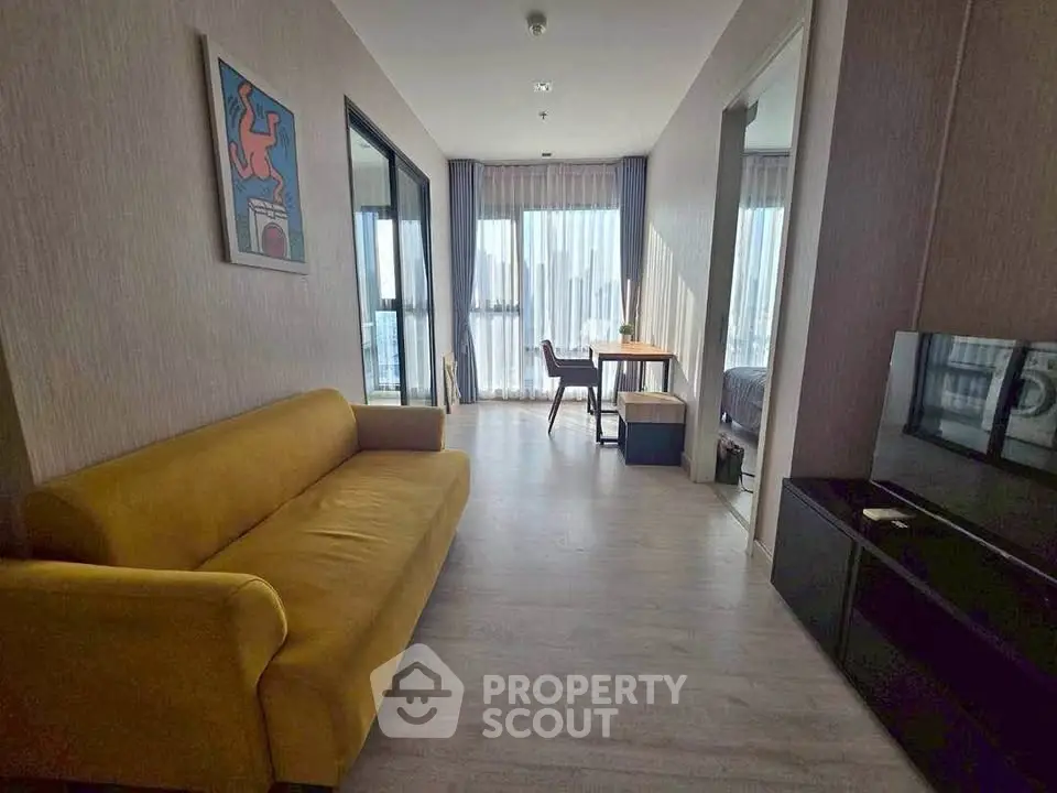 Modern living room with yellow sofa and city view, perfect for urban living.