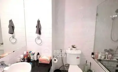 Modern bathroom with sleek fixtures and white tile design