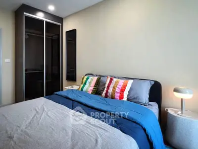 Modern bedroom with stylish decor and ample storage space