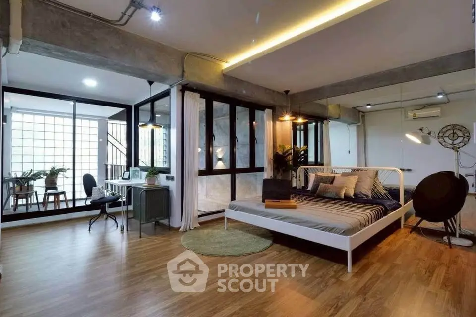 Spacious modern bedroom with stylish decor and natural light