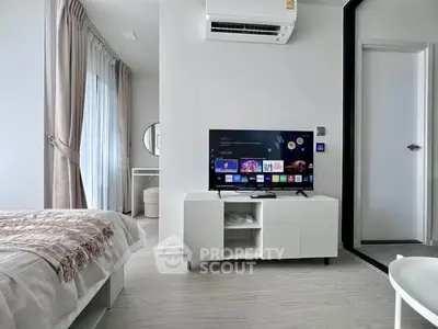 Modern bedroom with sleek TV setup and stylish decor
