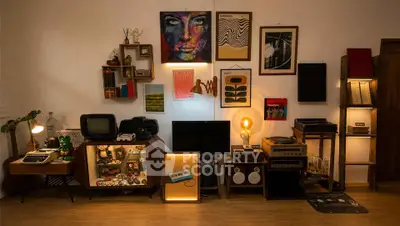 Stylish living room with vintage decor and modern art, showcasing a cozy and eclectic atmosphere.