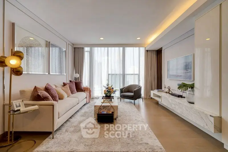 Luxurious modern living room with elegant decor and floor-to-ceiling windows.