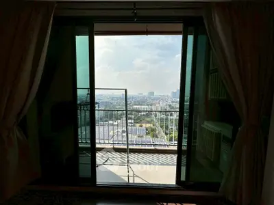 Spacious balcony with stunning city view from a modern apartment, perfect for relaxation and enjoying the skyline.