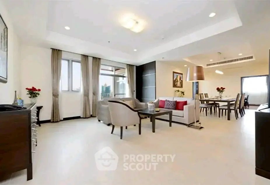 Spacious modern living room with elegant dining area and stylish decor