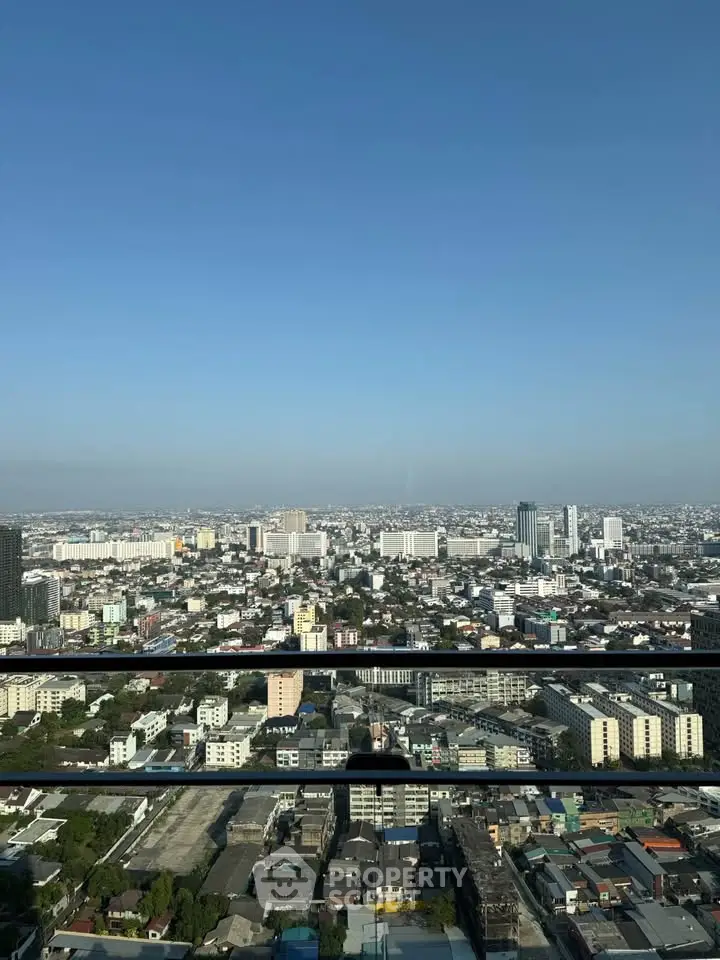 Stunning cityscape view from high-rise balcony showcasing urban skyline.