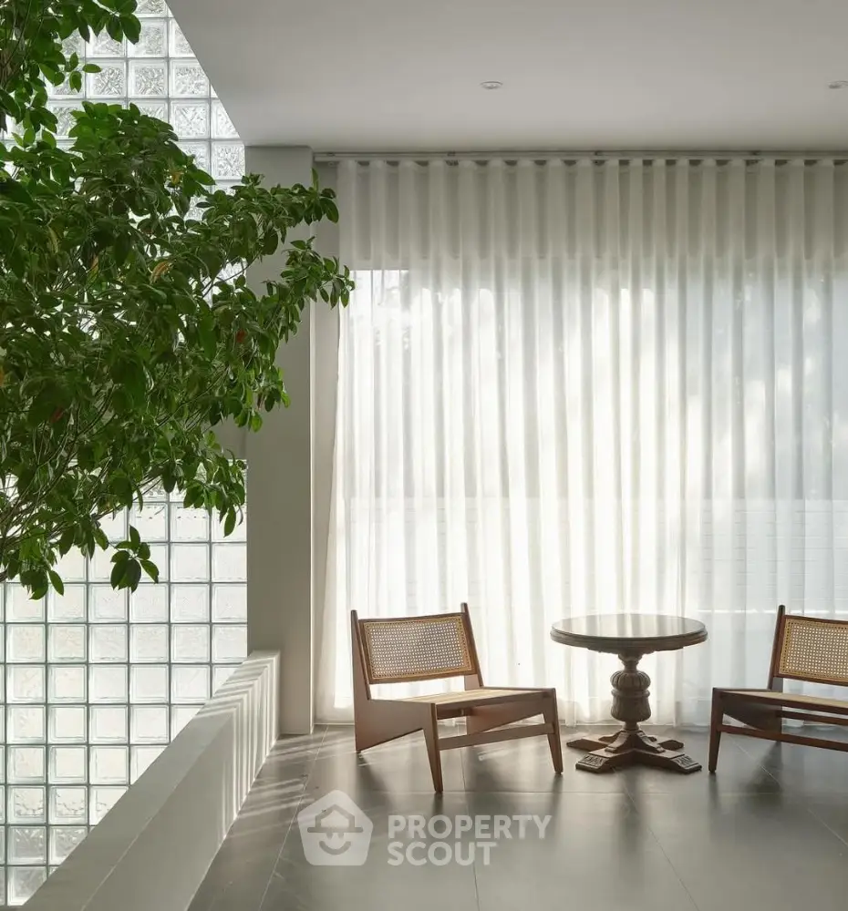 Elegant modern living area with natural light and stylish furniture