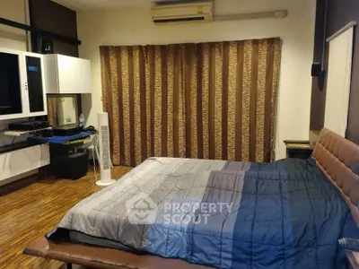 Cozy bedroom with modern decor and wooden flooring