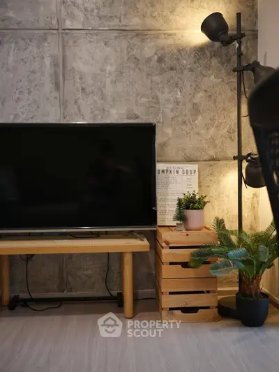 Stylish modern living room with TV and cozy decor elements.