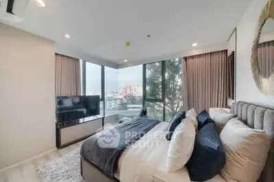 Luxurious bedroom with panoramic city view and modern decor