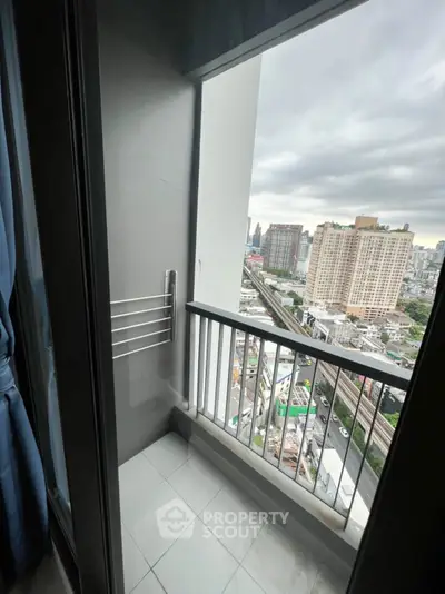 High-rise balcony with city view, perfect for urban living.