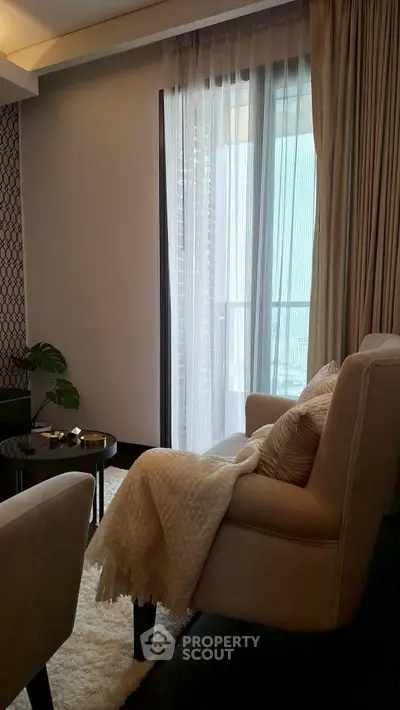 Cozy living room with elegant decor and balcony view