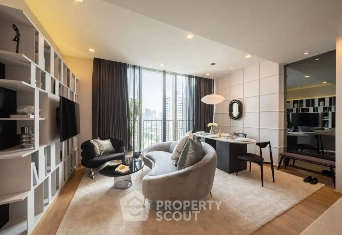 Luxurious modern living room with elegant furniture and city view, perfect for urban living.